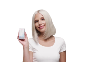 Blonde woman rinsing hair with shampoo after Wella ColorCharm toner treatment